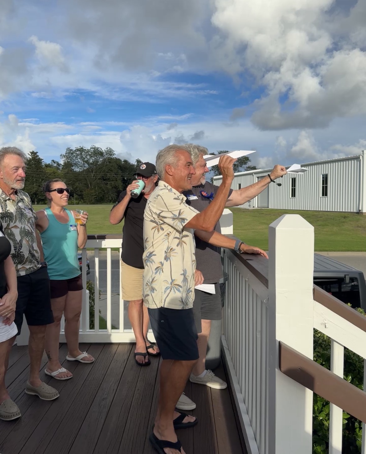 Paper Airplane Competition Takes Flight During Happy Hour, marina outing photograph 2