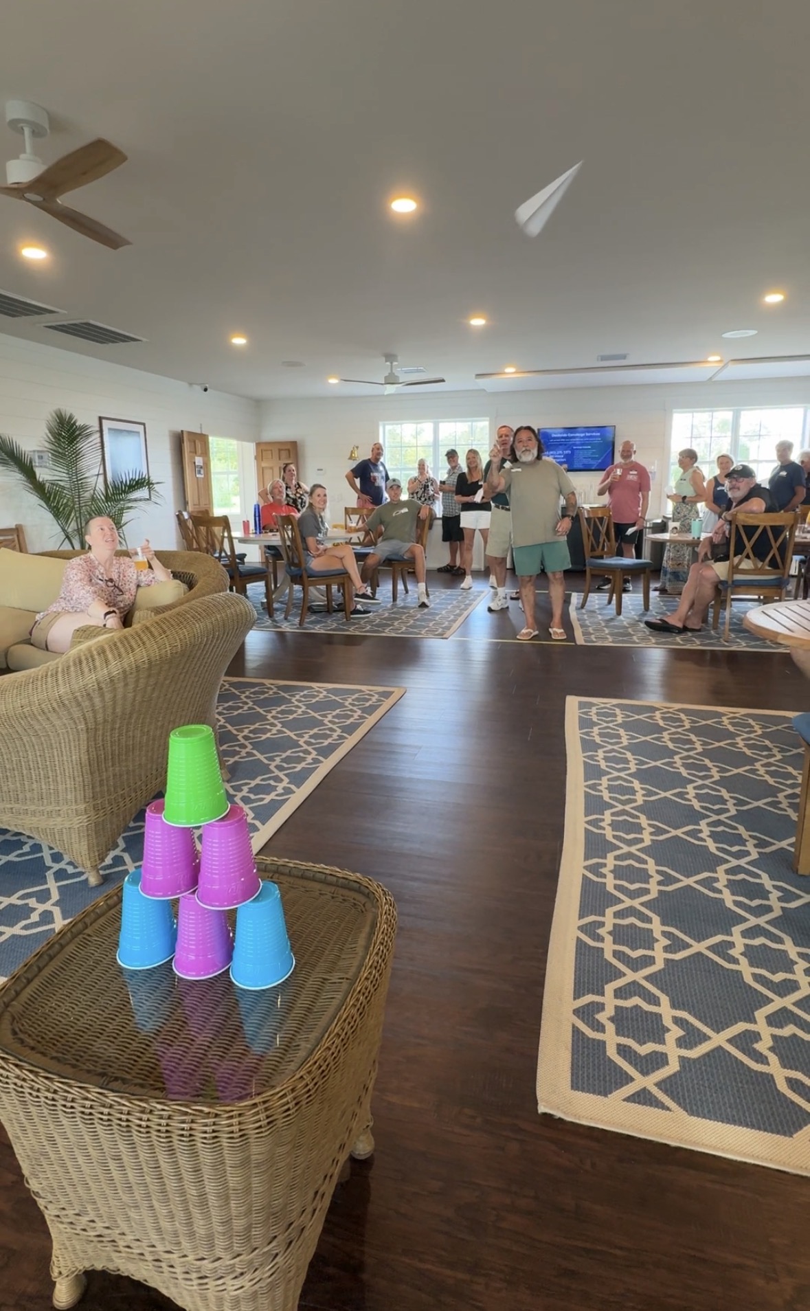 Paper Airplane Competition Takes Flight During Happy Hour, marina outing photograph 3