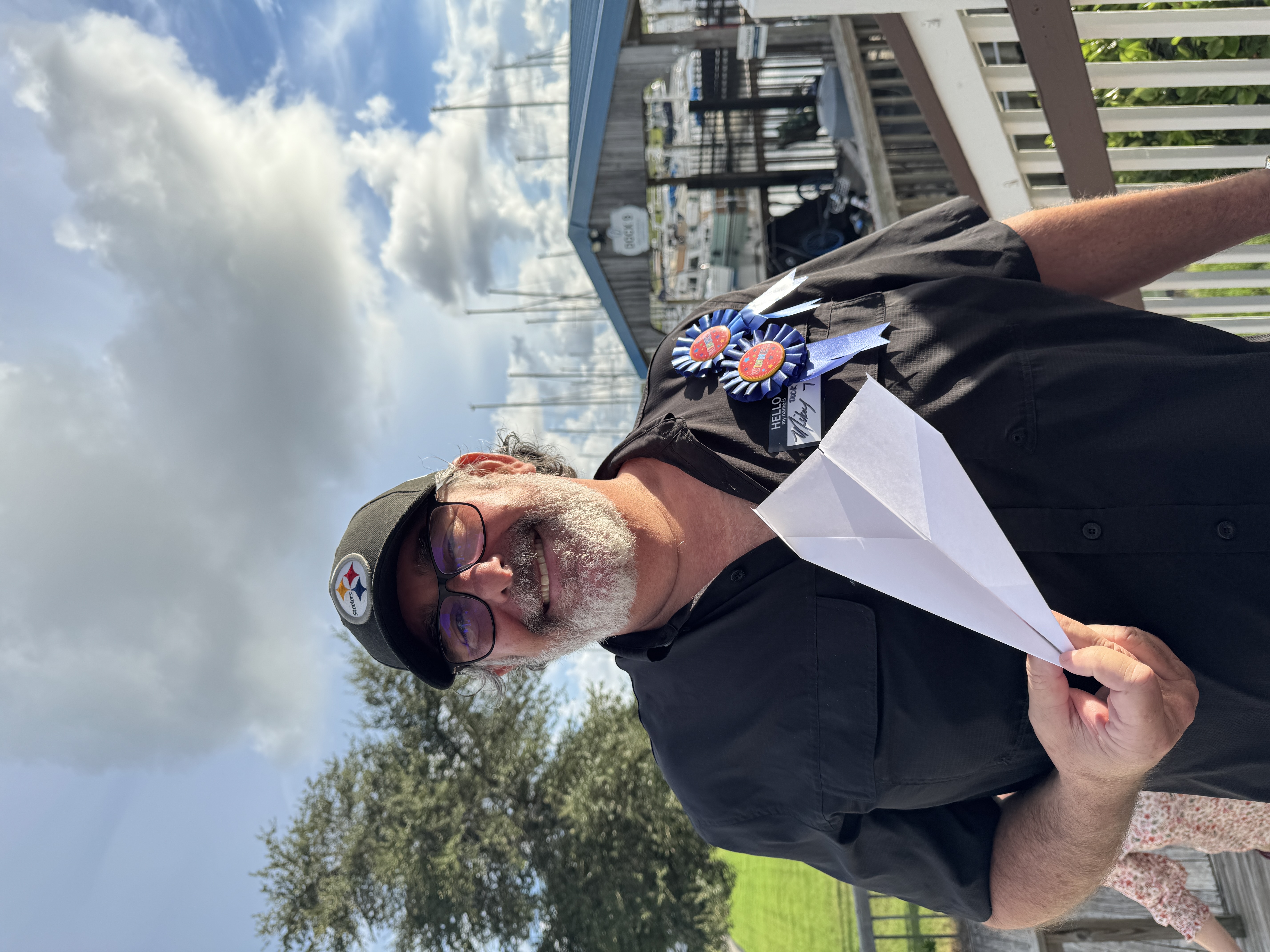 Paper Airplane Competition Takes Flight During Happy Hour, marina outing photograph 5
