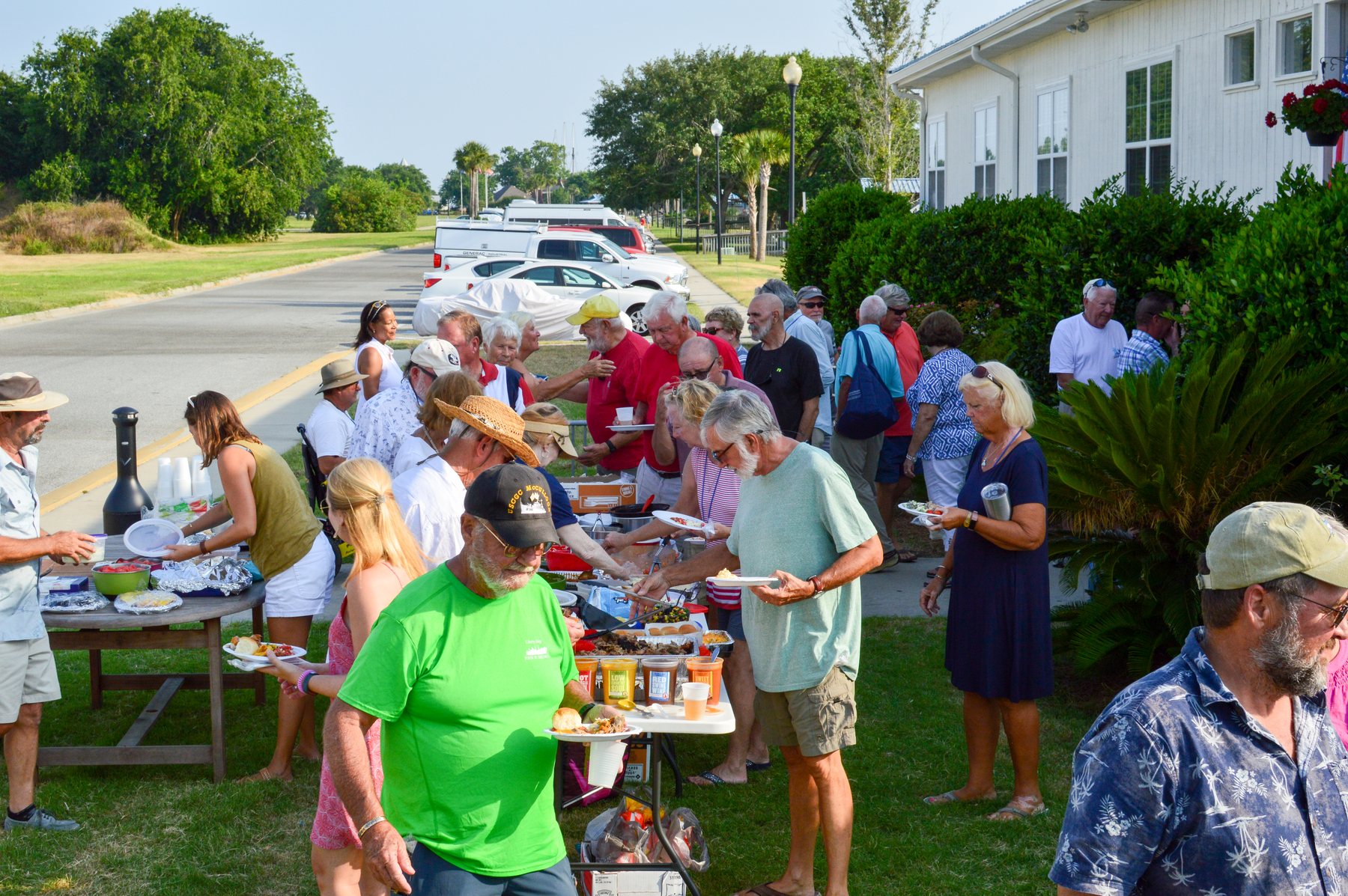 Marina guests sharing food at a Brunswick Landing Memorial Day gathering