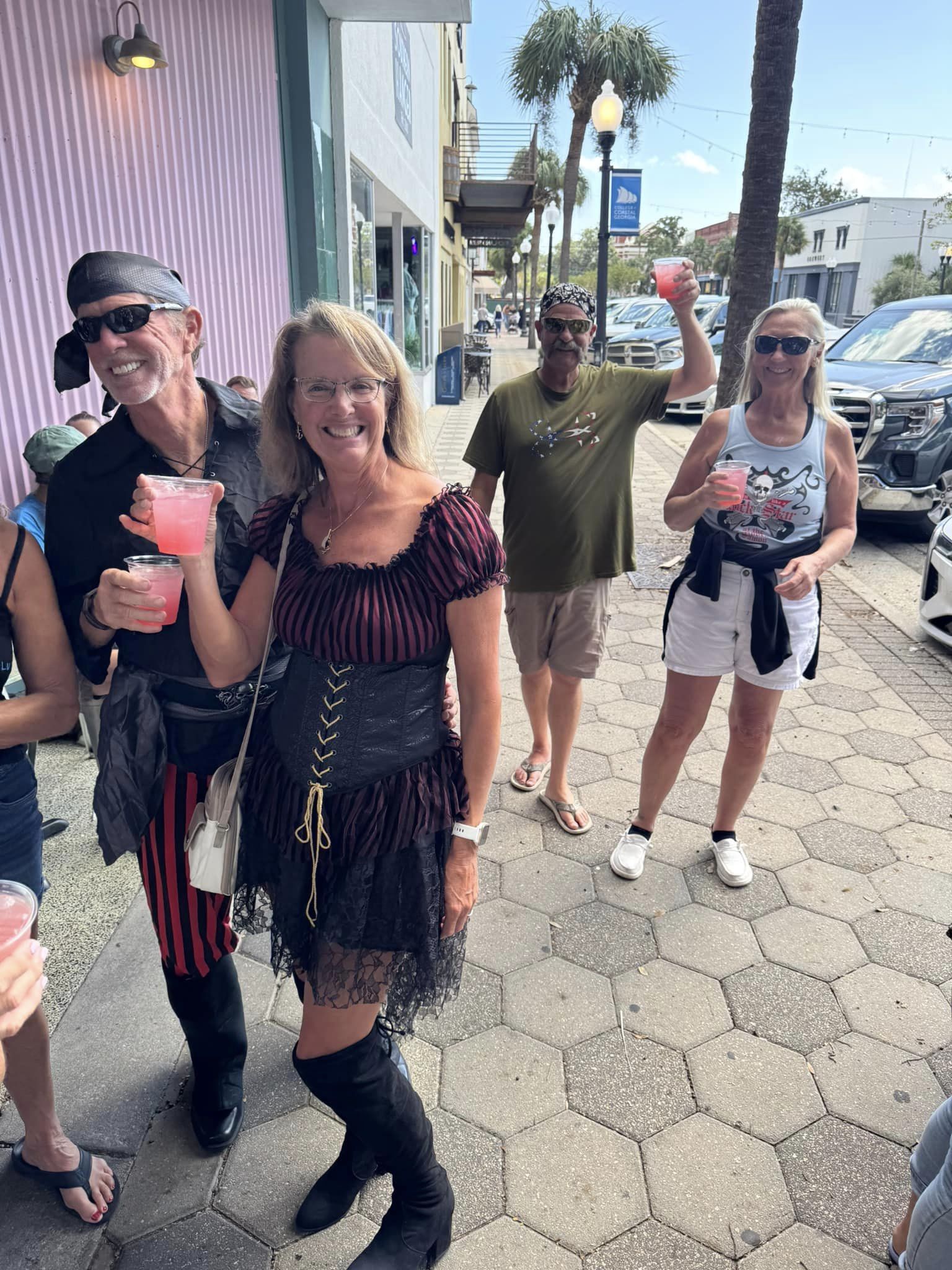 Pirate-costumed marina friends enjoying the Historic Downtown Brunswick pub crawl