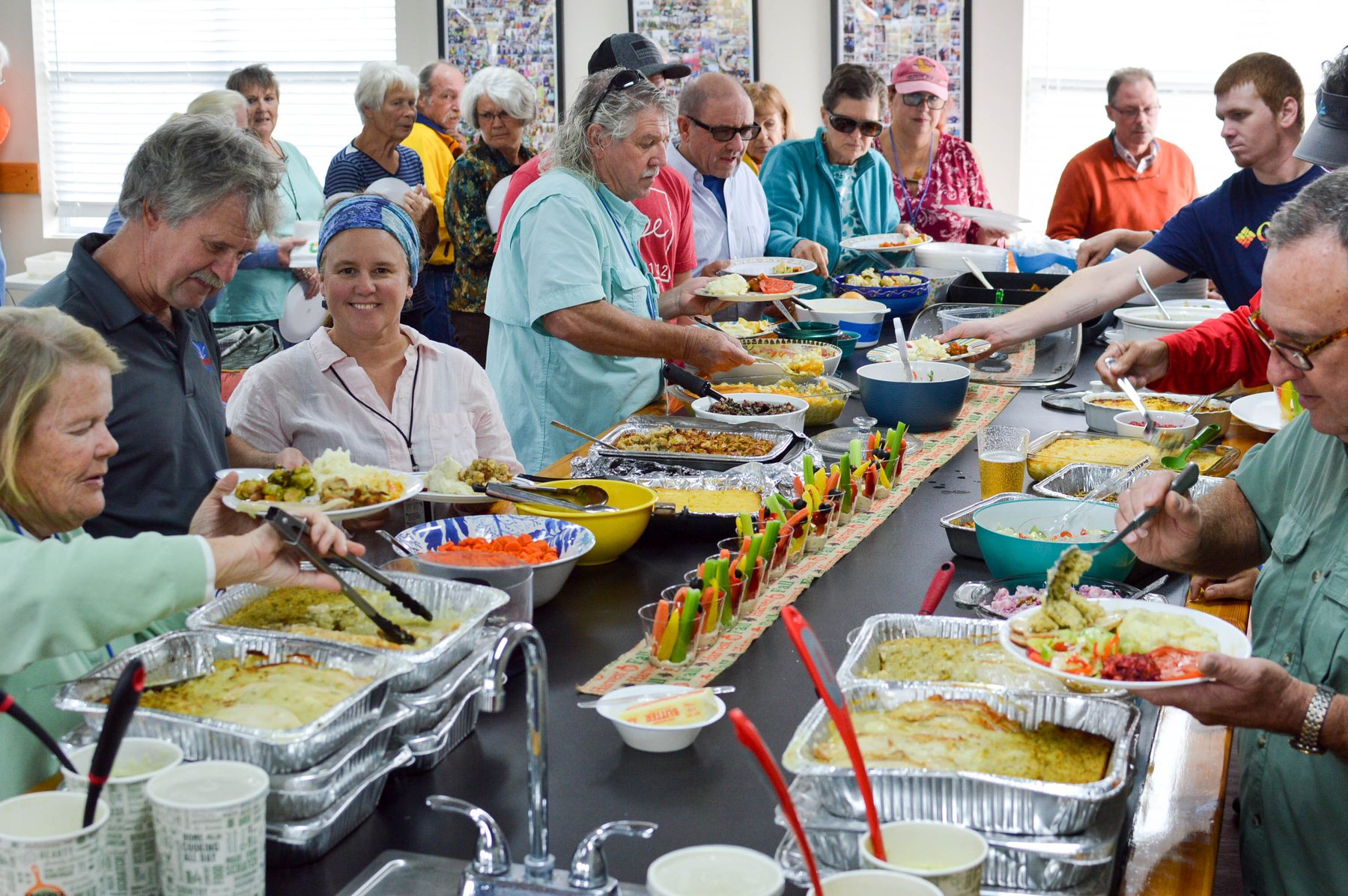 Cruisers sharing a Thanksgiving buffet inside the Brunswick Landing Yacht Club